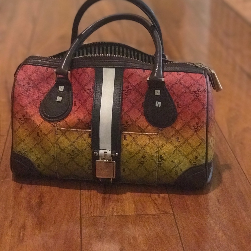 I’m selling my Lamb handbag w/ wallet & coin purse